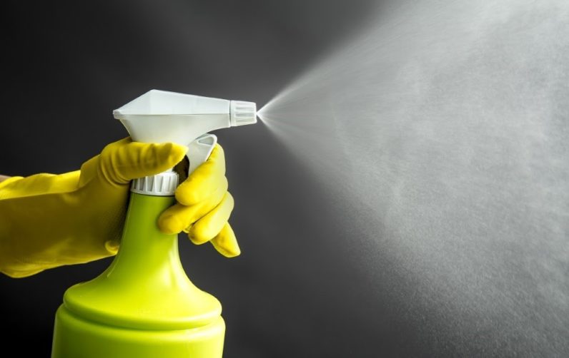 spraying disinfectant